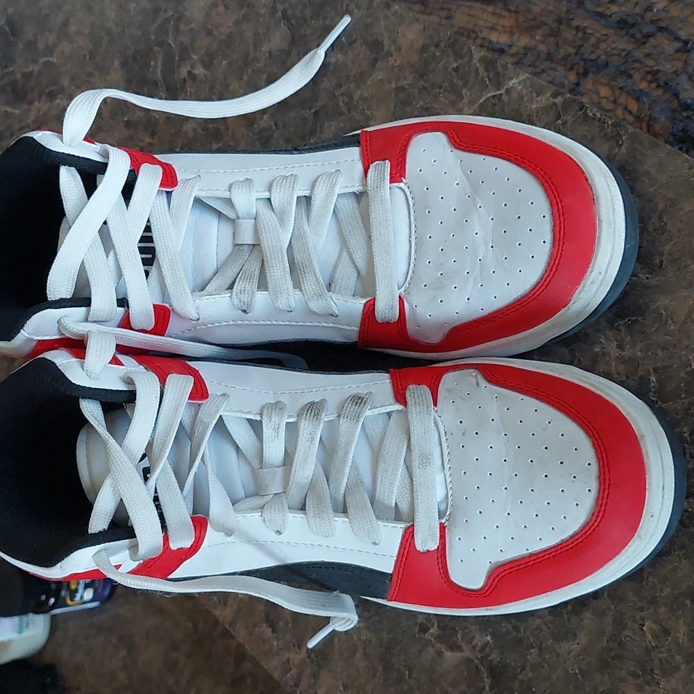 Puma red, black, and white tennis shoes
